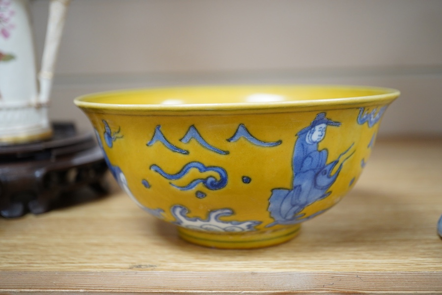 A Chinese blue and white brush holder and a yellow ground bowl, 16cm diameter, Condition - good